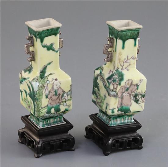 A pair of Chinese miniature enamelled biscuit (susancai) vases, 18th century, H. 8.3cm, wood stands, in a fitted hongmu case